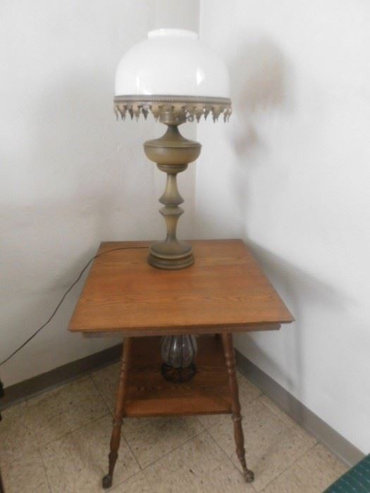 Antique twist leg glass ball and claw foot table with mid century metal lamp