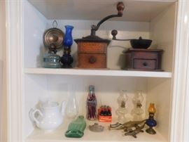 Coffee mills,small Coca Cola collectibles and small oil lamps