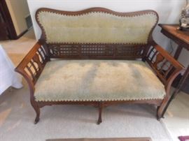 20th Century Oak Carved Love Seat with original casters. 47 by 35