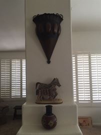 Large heavy metal art on top.  Beautiful horse home accessory.  Beaded art vase in black, reds and cream yellow colors.