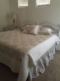 King bed (pillow-top Sealy mattress).  King Comforter set by Eddie Bower.  Headborad is a matching vintage wicker set in excellent condition.  