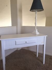 Pottery Barn Desk planked.  White lamp with denim lampshade