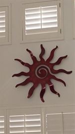 Red metal sun wall art