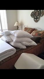 Queen bed with comforter sheets and pillows.  All unused pillows.  Queen size memory foam topper