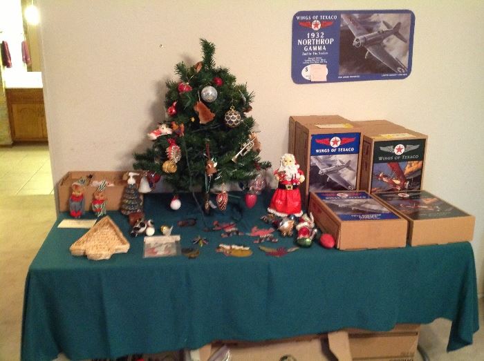 Holiday tree, decorations, wings of Texaco airplane banks.