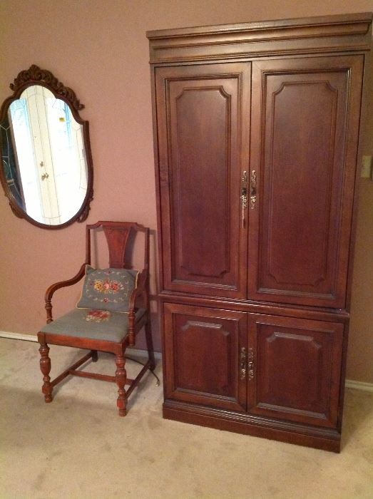 TV cabinet, vintage chair and mirror.