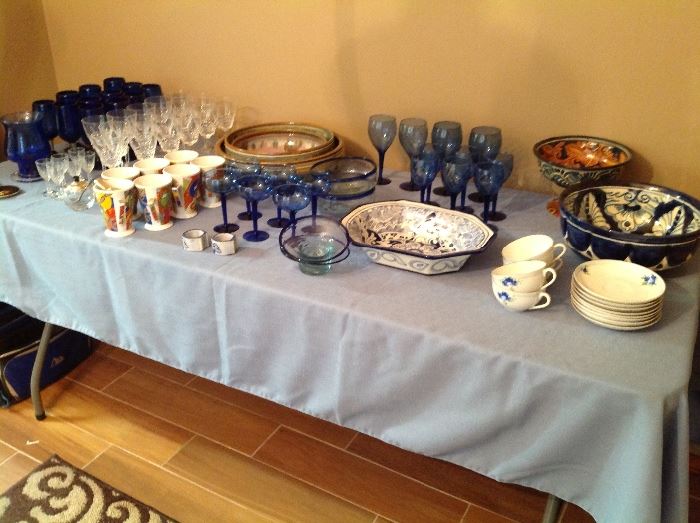 Blue glassware, pottery, and serving items.