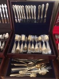 12 place settings with serving pieces