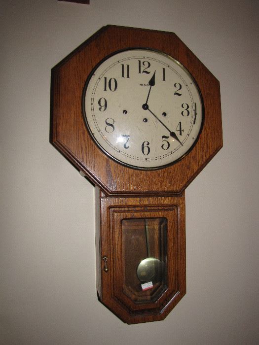 A pendulum wall clock.