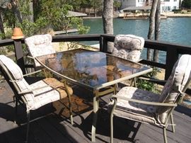 Glass Top Patio Table with Four Chairs and Nice Covers for the Chairs... 