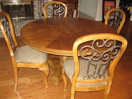 54" Round Table with Four Chairs by Ashley Furniture...