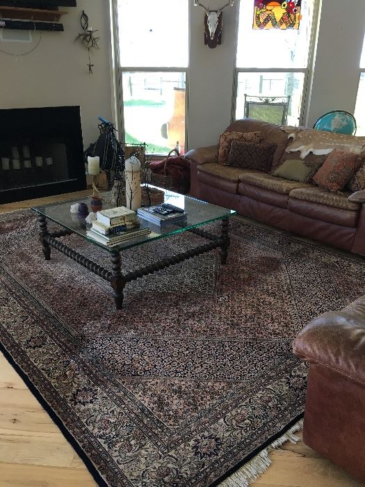 Large area rug, Sofa and glass coffee table