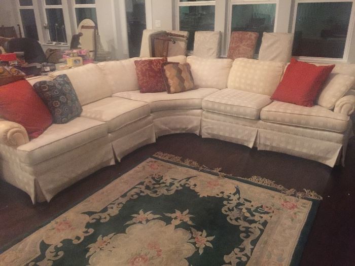 Ethan Allen white sectional sofa
Green and white area rug