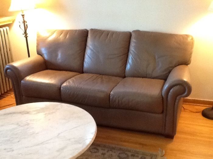 Very good quality leather sofa, in good condition but it has been well loved