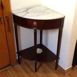 Reproduction corner table with marble top.