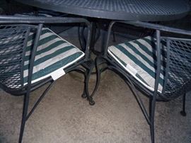 Woodard wrought iron patio table and four chairs with chaise
