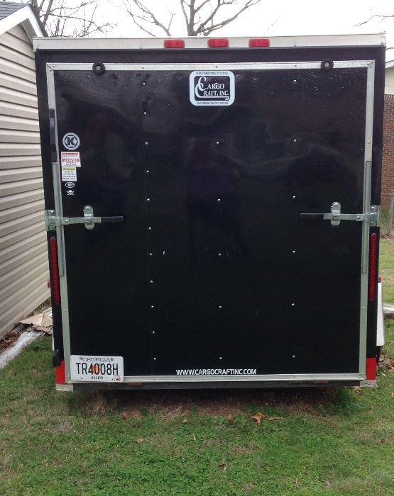 Rear view of the Cargo Craft Trailer. Size deminsions are 6' wide x 12' long x 6' high and features an overhead ventilation. 