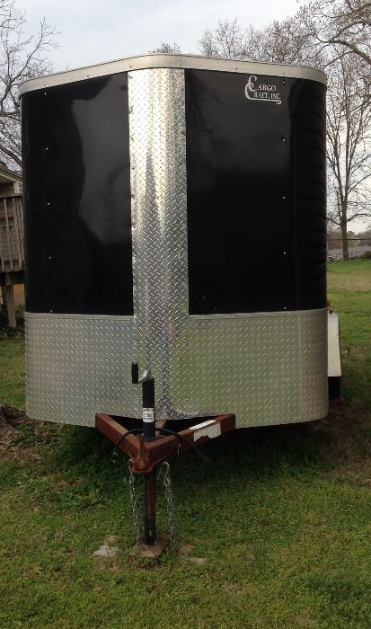 Cargo Craft Trailer built in TX and is 3 years old. Deminsions are 6' wide x 12' long x 6' high. This trailer comes equipped with AC Electricity and DC Interior Lights. Special features are built in extra storage binds, wall storage, and has an exterior side door. Very nice! 