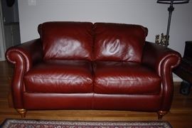 Two leather Natuzzi Loveseat