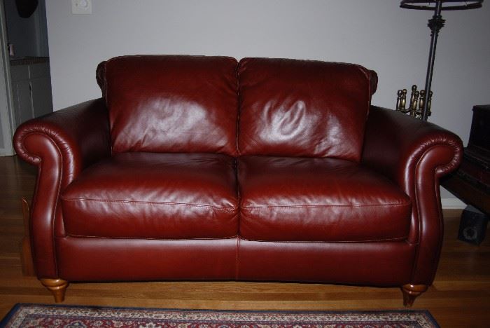 Two leather Natuzzi Loveseat