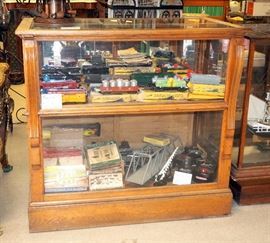 Carved Front Two-Shelf Display Cabinet With Mirror and Sliding Doors, 43.75"T x 47"W x 27"D