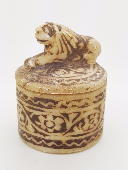 6-An ancient Near Eastern calcite alabaster cosmetic jar with lioness lid carving; decorated with floral motif thoroughly. 3"Hx 2.1/4"D