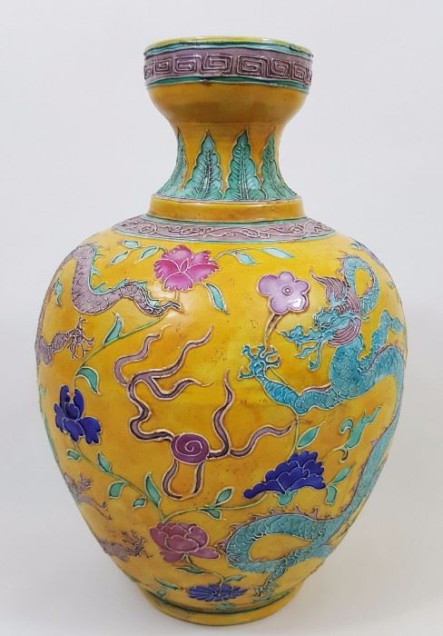 9- A Fahua color bowl mouth vase decorated with key fret band; at the shoulder 6 blue character marks at white reserved area. Colorful floral carvings and depictions of two 5-clawed dragons chasing the flaring pearl. 12"Hx 7.5"D