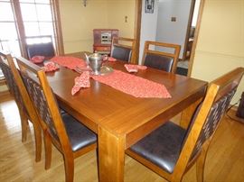 Dining room table w/ 6 chairs and 1 leaf . Matching Buffet / server 
