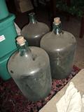 Large green glass bottles with original corks
