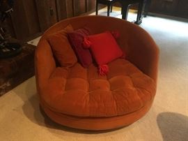 Thayer Coggin, High Point. Designed by Milo Baughman. Swivel chair. Tag still on. Cushion is stained on the bottom and minor staining on other (top) side. See further photos for details. 