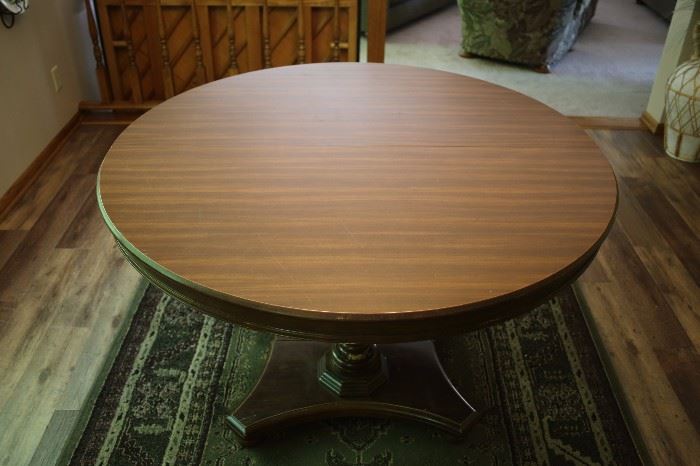 Round pedestal table - seats 4-6 comfortably.  Chairs not available.