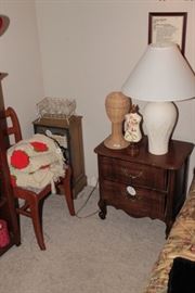 Nightstand, small cabinet, and a chair