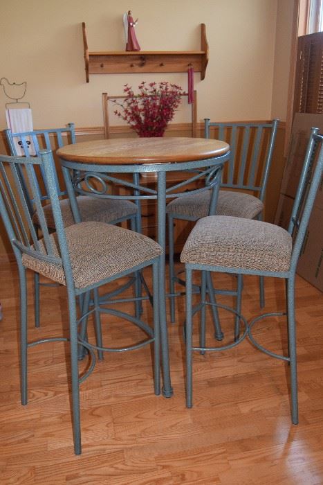 High top table with metal base; four chairs
