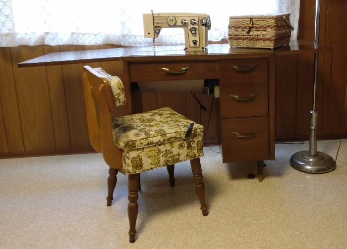 Vintage sewing machine in cabinet w/chair