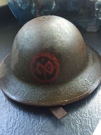 World War I Doughboy Helmet with chin strap and insignia