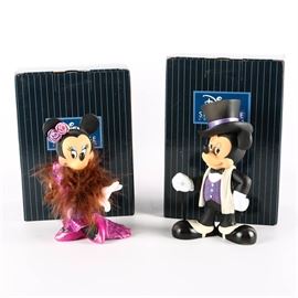Disney Figurines of Mickey and Minnie in Black Tie: A pair of Disney figurines of Mickey and Minnie Mouse in fancy black tie attire. Both are from the Disney Showcase Collection for Enesco. Each figurine is crafted out of stone resin, hand-painted and presented in its original box.