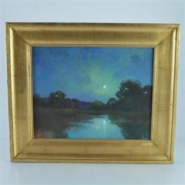 R. Michael Shannon Oil Painting of Night Landscape: An original oil painting on canvas of nighttime landscape by Kentucky artist R. Michael Shannon. This piece depicts a landscape at night, featuring the moon illuminated in the sky and shining down on a body of water flanked by trees. The color scheme consists of blues and greens. The canvas is mounted on board and presented in a gold toned molded frame.
