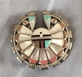 These pieces are made by the Zuni tribe. They are known for their unique designs and amazing artwork. They are made from sterling silver and beautifully inlayed with tones such as Turquoise, Mother of Pearl, Coral, Black Onyx.