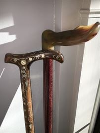 Fabulous walking canes with inlays - the other with polished horn handle.