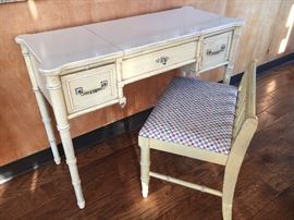 Matching vanity. Middle comes up and there is a well for makeup and a mirror!