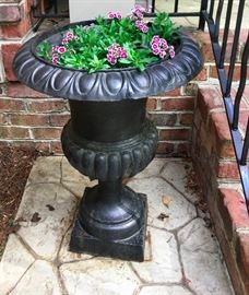 A pair of Iron flower pots with real flowers!