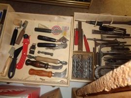 Painting supplies, razors, edgers, screen repair tools.