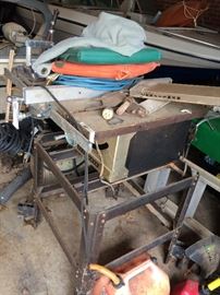#117 Craftsman table saw on rolling stand $60