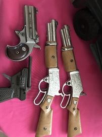 Toy cap guns; Nicols Spitfire, Nicols Derringer and Hawk Tin cap gun