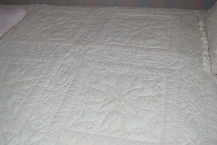 Beige candle wicking quilt with tulip design