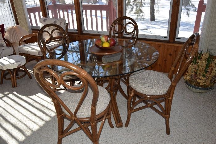 Rattan round glass top table and four chairs