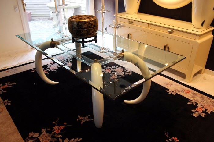Faux ivory tusk and brass base with lucite and glass. Merjing Asian style rug 