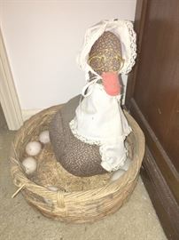 Mama Duck on Her Eggs in a Basket