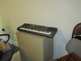 Casio keyboard - metal file cabinet