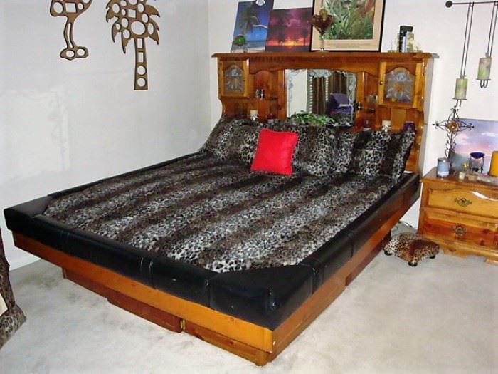 KING SIZE "WATER BED" WITH BEDDING, ETCHED & LIGHTED STORAGE ON EACH SIDE OF THE HEADBOARD (SEE NEXT PIC) - WE HAVE THE MATCHING DRESSER & NIGHT STANDS. KEEP IN MIND IF YOU DONT WANT THE WATERBED MATTRESS YOU CAN USE A REGULAR MATTRESS.
